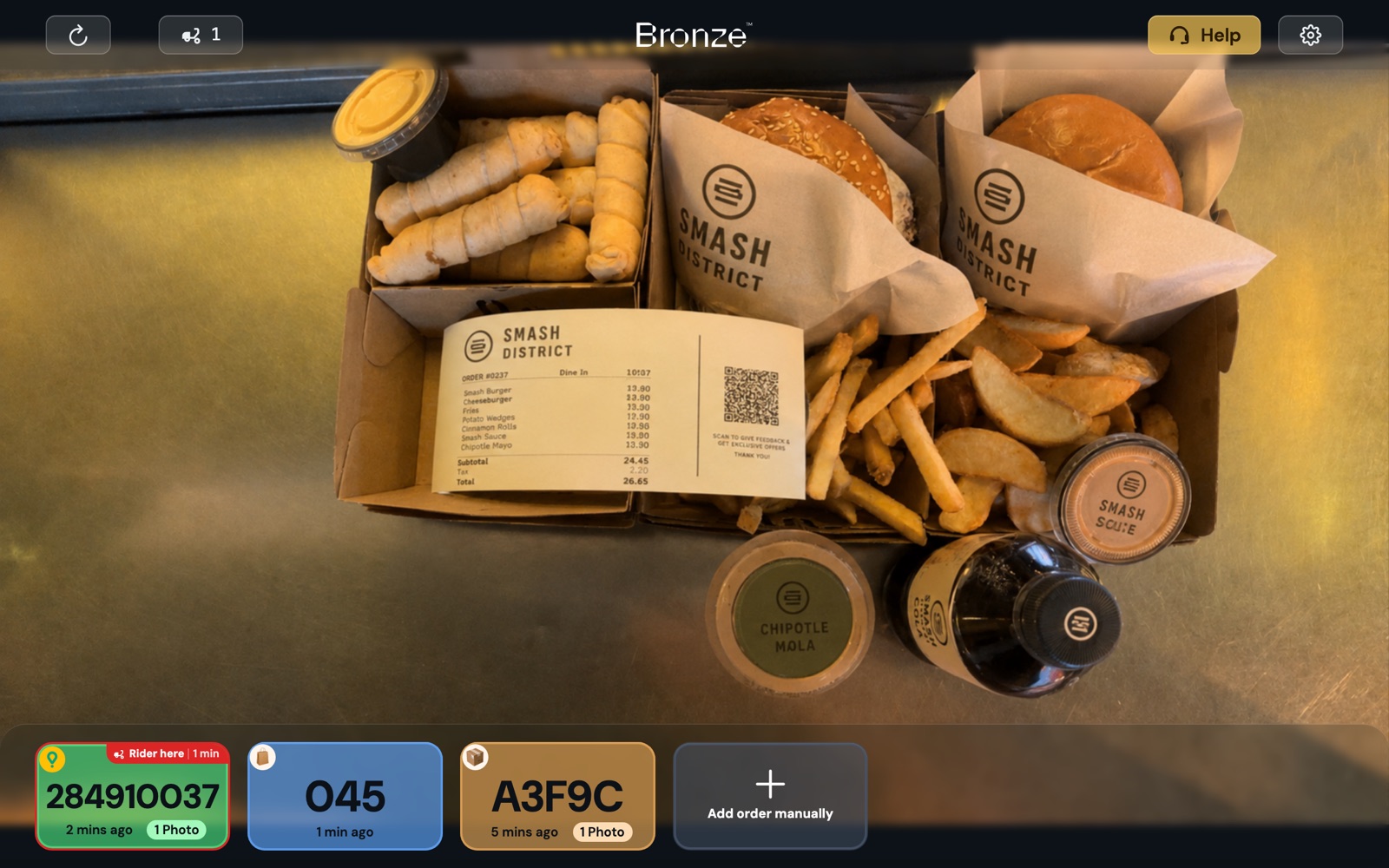 The camera screen with an order framed and the order strip along the bottom